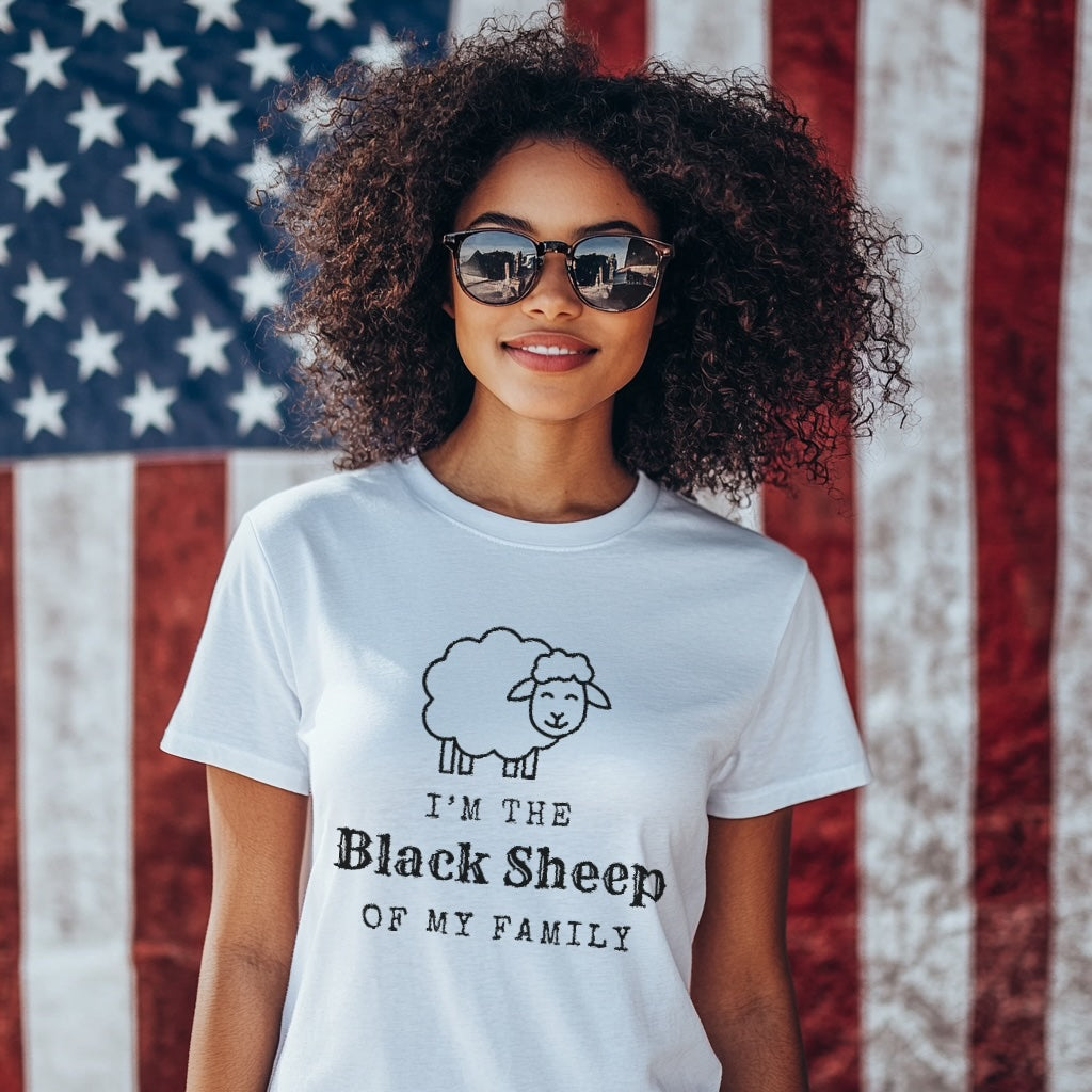 Woman wearing a t-shirt with 'I'm the Black Sheep of My Family' design in front of an American flag.