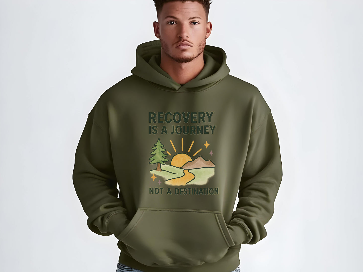 Man wearing a green hoodie with  'Recovery is a Journey, Not a Destination' and nature graphic on a white background