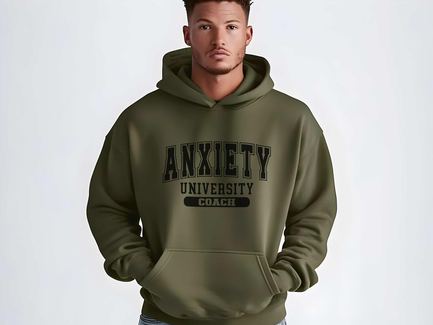 Person wearing a green hoodie with 'Anxiety University Coach' text on a white background
