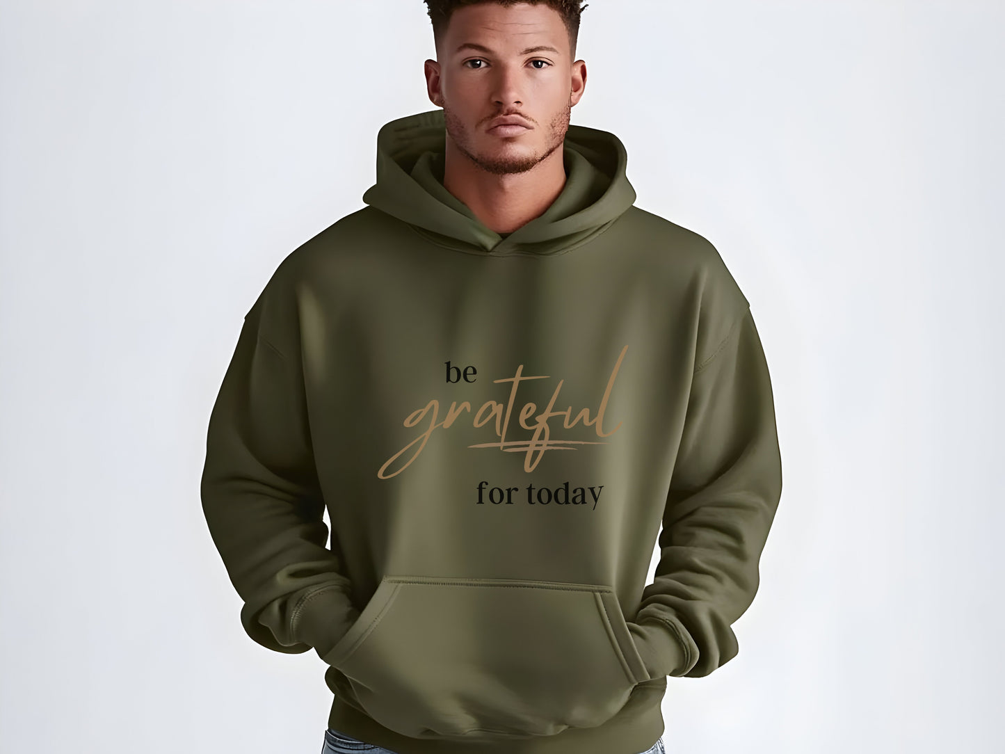 Man wearing a green hoodie with 'be grateful for today' text on a white background