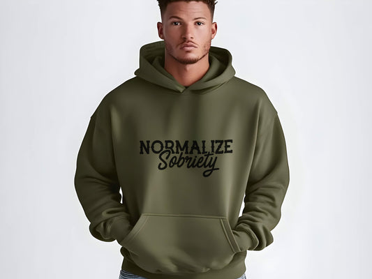 Man wearing a green hoodie with 'Normalize Sobriety' text on a white background