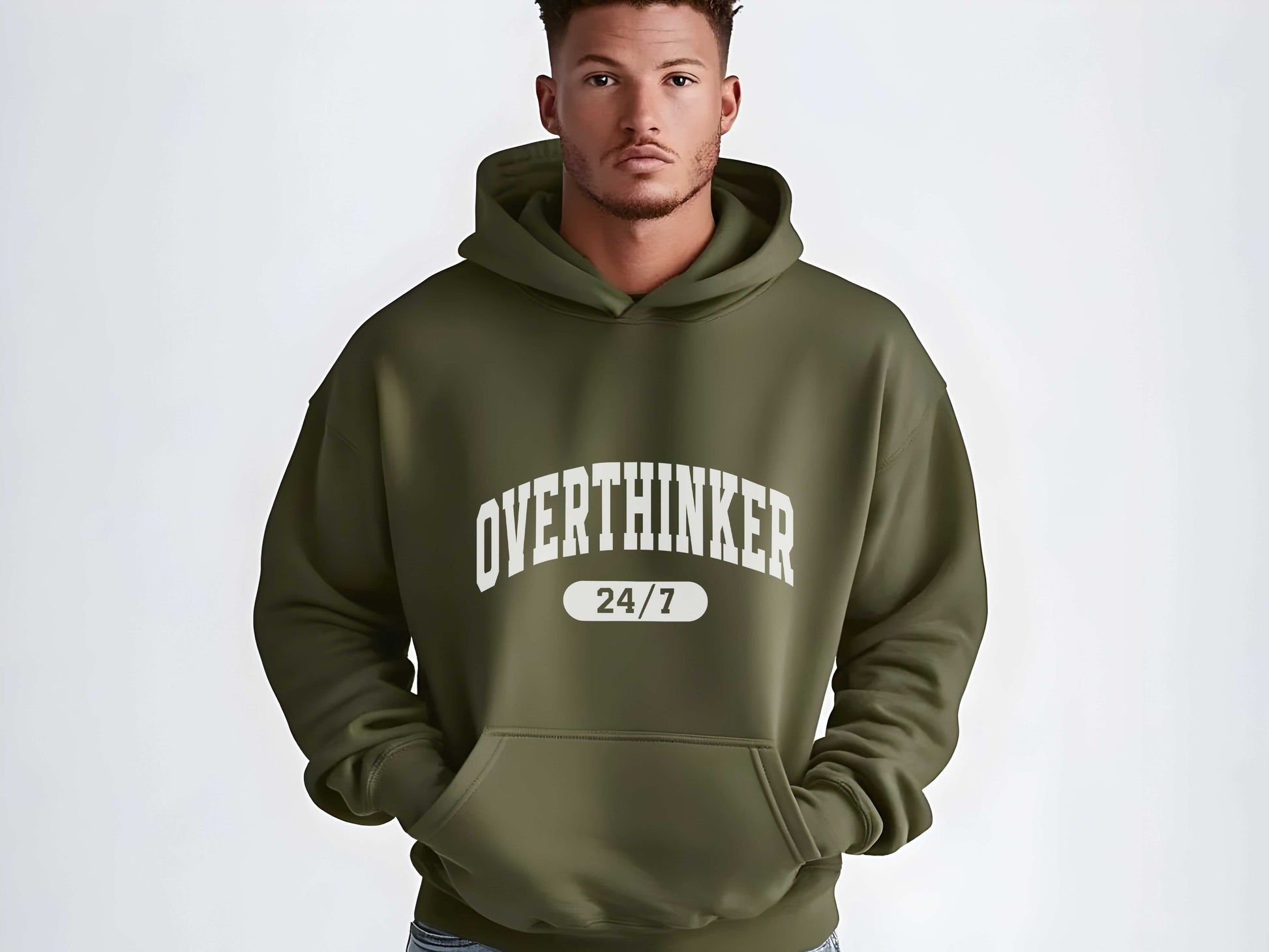 Man wearing a green hoodie with 'OVER THINKER 24/7' text on a white background