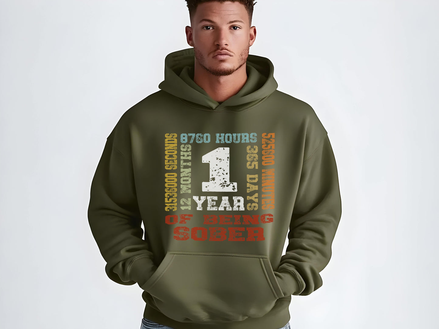 Man wearing a green hoodie with motivational '1 year sober' on a white background