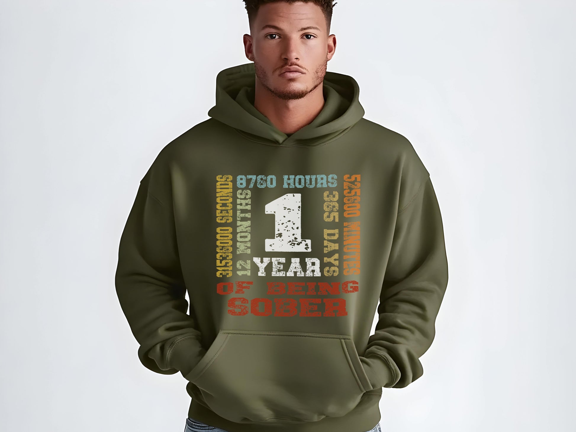 Man wearing a green hoodie with motivational '1 year sober' on a white background
