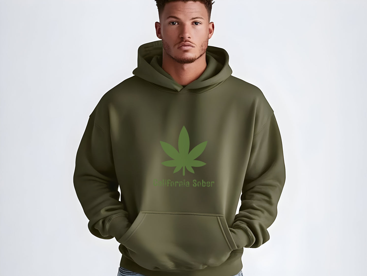 Man wearing a green hoodie with a cannabis leaf design on a white background