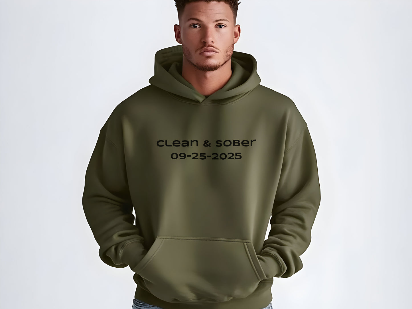 Man wearing a green hoodie with 'clean & sober' text on a white background
