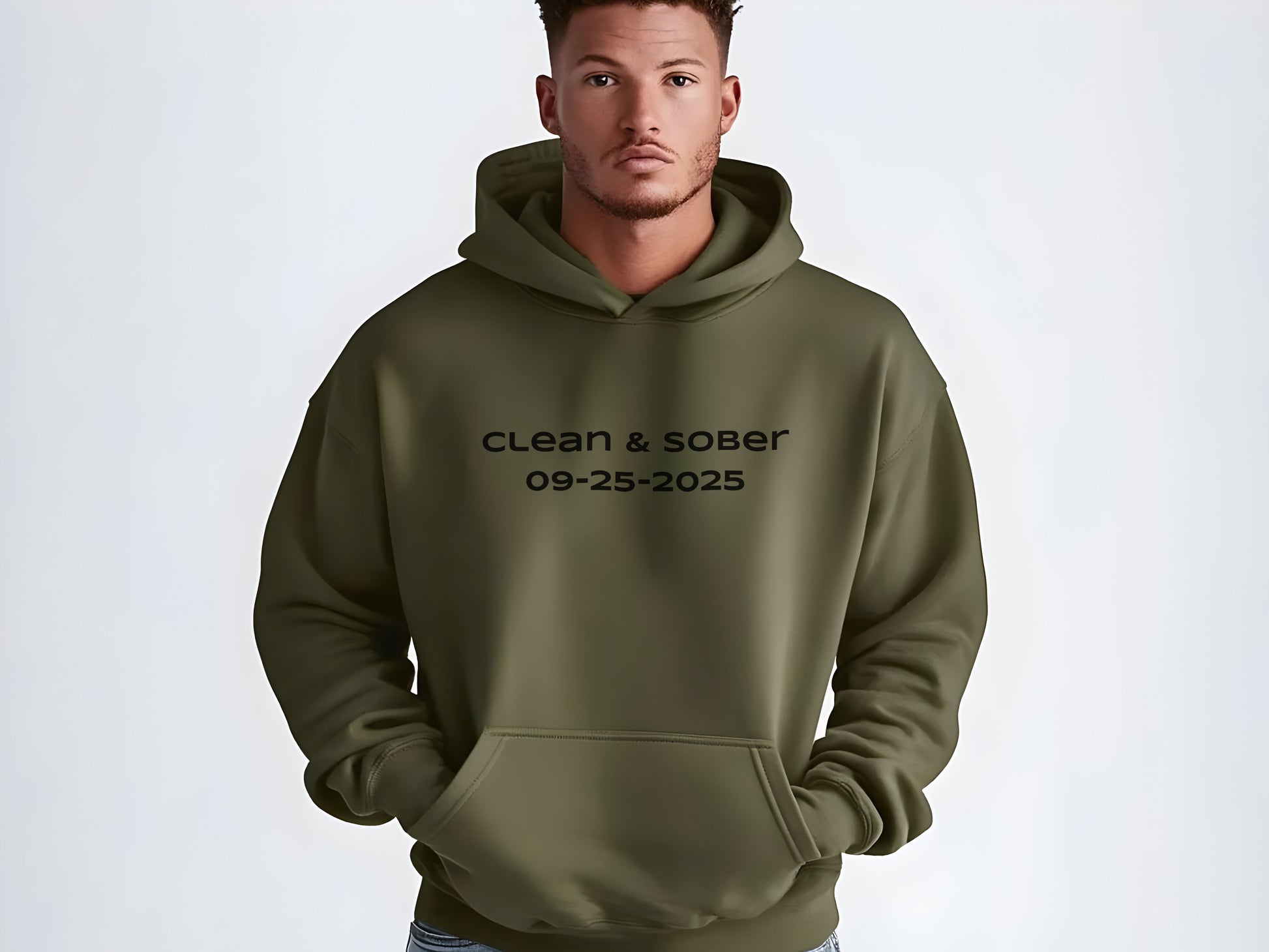 Man wearing a green hoodie with 'clean & sober' text on a white background