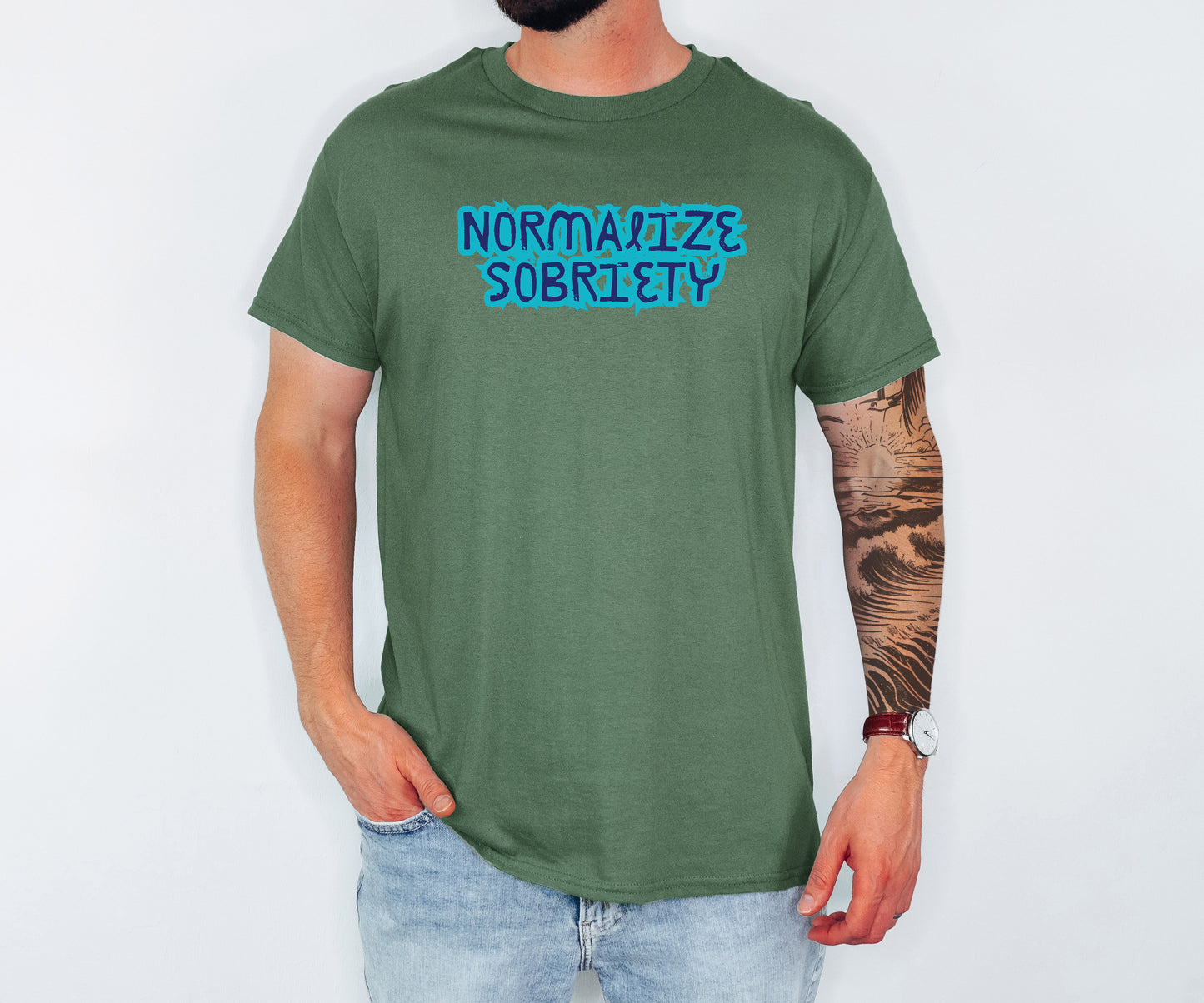 Person wearing a green t-shirt with 'NORMALIZE SOBRIETY' text on a white background