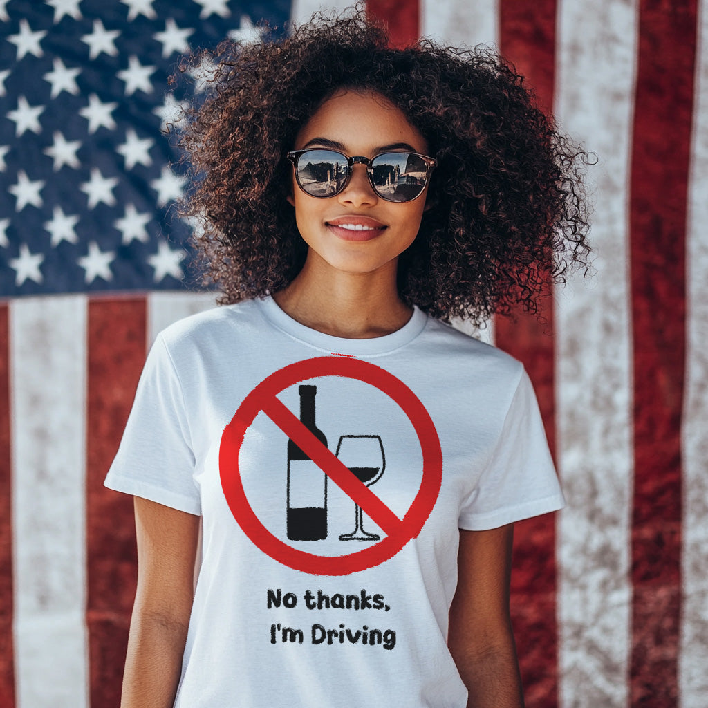 Person wearing a t-shirt with a no drinking while driving symbol and text in front of an American flag.