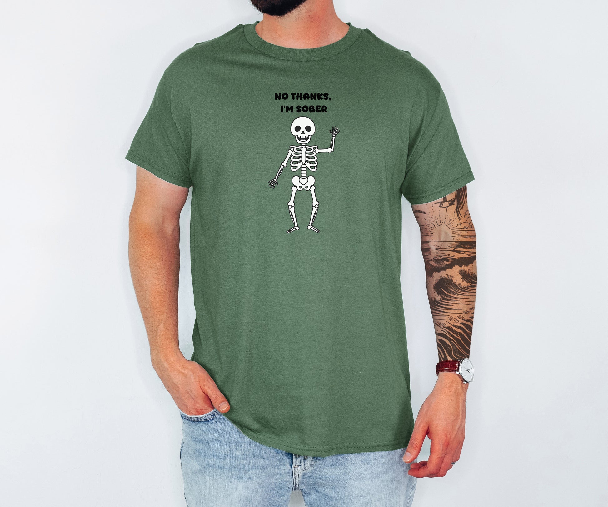 Person wearing a green t-shirt with a skeleton graphic and "No thanks, I'm sober" on a white background