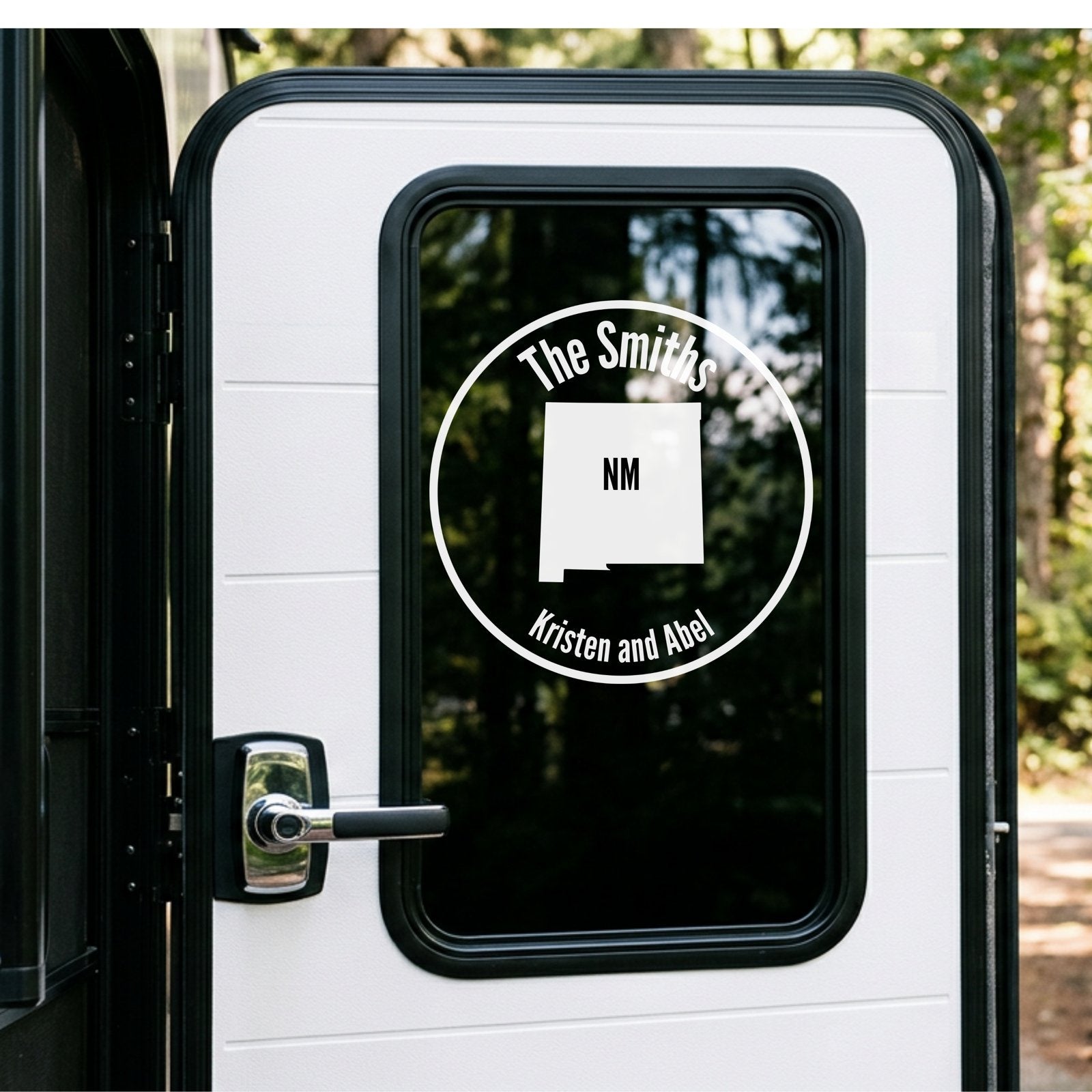Personalized RV decal applied to camper window with state shape and family name