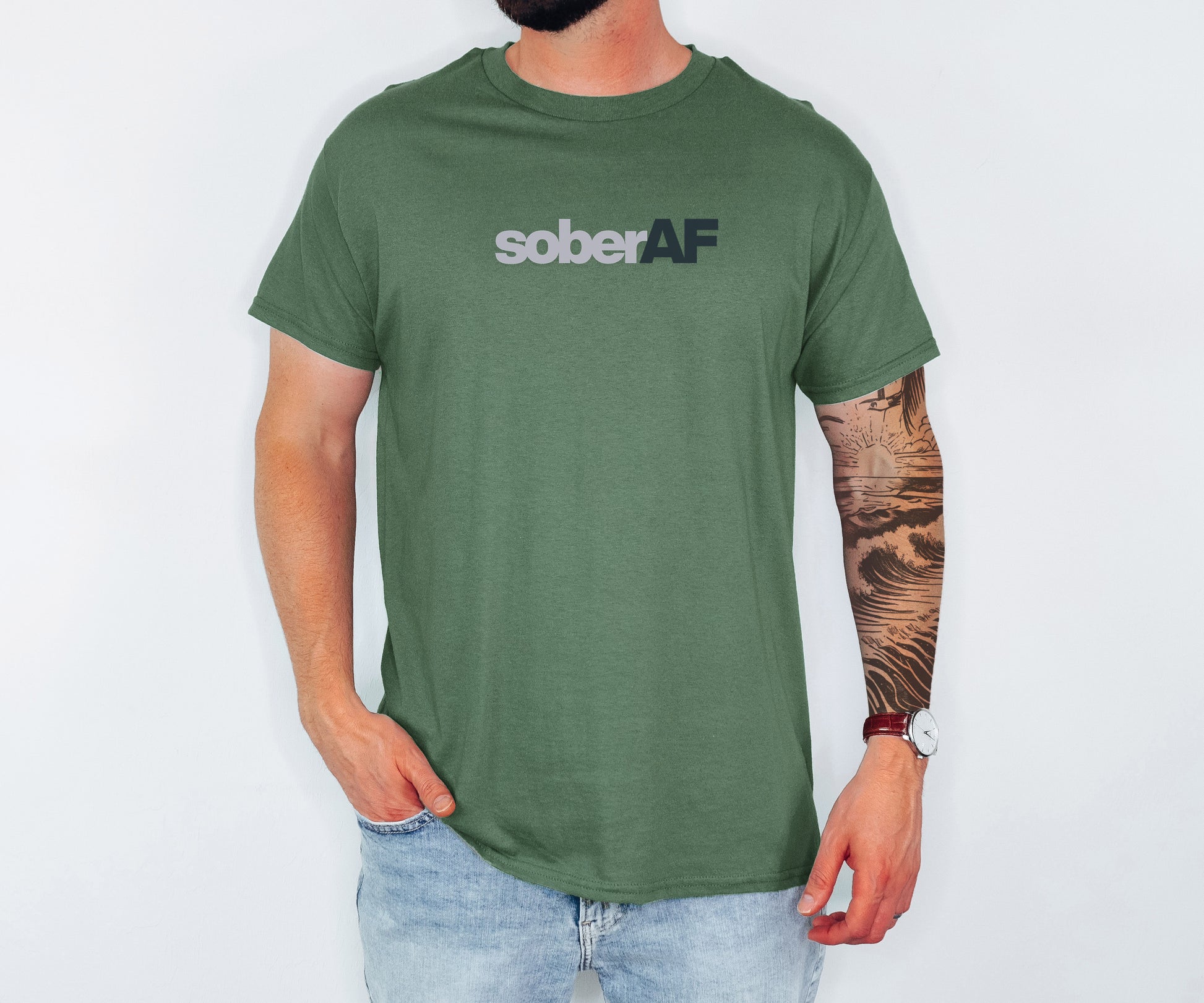 Person wearing a green t-shirt with 'soberAF' text on a plain background